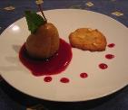 Poacked Forelle pear with blackberry sauce and almond cookie.
